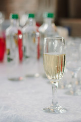 Glass filled by fresh champagne on restaurant.