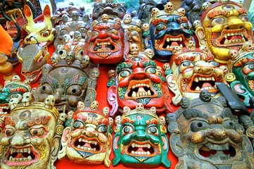 Colorfully painted traditional wood carving mask selling in the market, Bhutan.