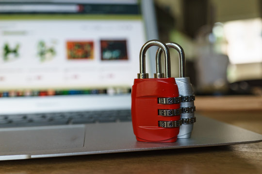 Computer security concept, with combination lock pad with the background of computer website