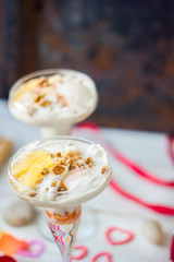 Beautiful dessert for Valentine's day - ice cream with orange.