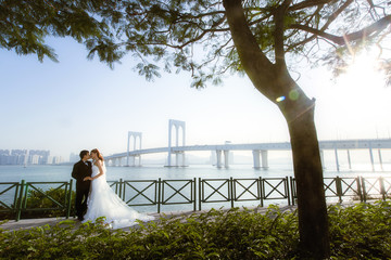 Young beautiful couple in love, man and woman on vacation in the Macau, love, pre-wedding photoshoot