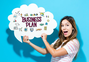 Business Plan text with young woman holding a speech bubble on a blue background