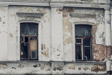 Fototapeta na wymiar Demolishing windows of an old brick house