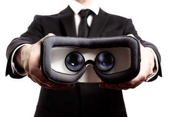Businessman with a virtual reality headset isolated on a white background