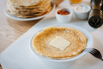 Butter and pancakes - russian national food on restaurant.