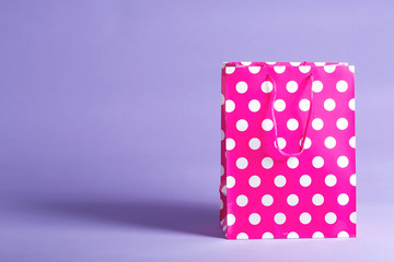 Polka dot gift bag on a vibrant background