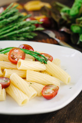 Pasta with asparagus and tomatoes ready to eat