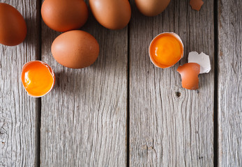 Fresh chicken brown eggs on rustic wood, organic farming concept background