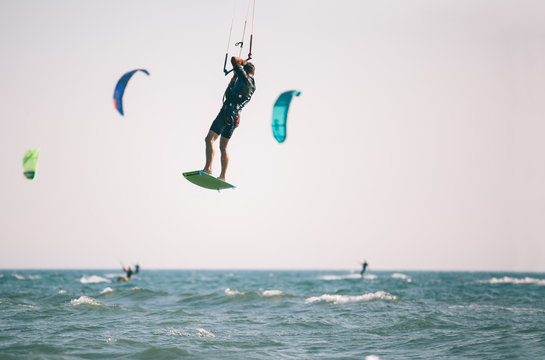 Kiteboarder athlete performing kiteboarding kitesurfing tricks unhooked