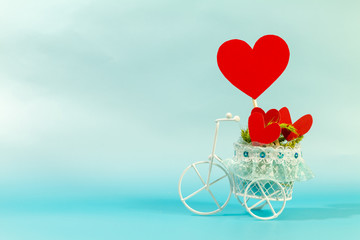 Vintage bicycle model transport a red heart for supporting when people get who lack of desire with love and Valentine's Day concept.