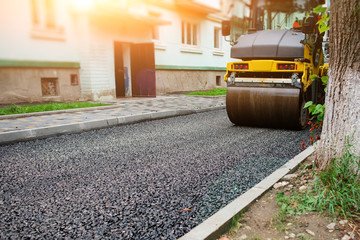 Background of asphalt roller that stack and press hot asphalt. Road repair machine