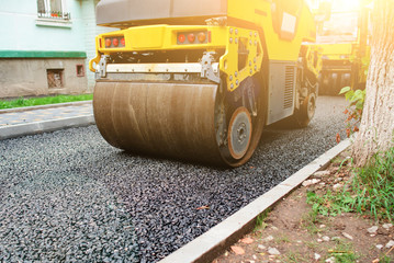 Background of asphalt roller that stack and press hot asphalt. Road repair machine