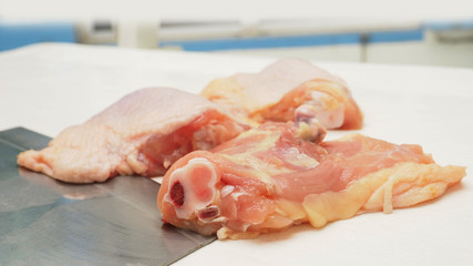 Hip Chicken cutting for cook in kitchen macro photo