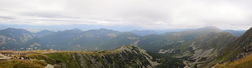 Fototapeta premium Tatra mountains landscape panorama with green grass and white clouds. Slovakia national park.