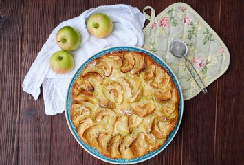 Delicious Apple pie with powdered sugar and fruits 