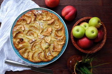 Delicious Apple pie with powdered sugar and fruits 