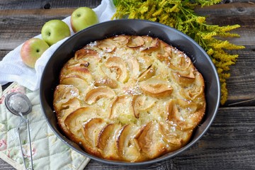 Delicious Apple pie with powdered sugar and fruits 