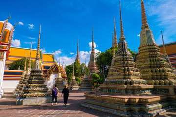Tourists is sightseeing around Wat Pho in Bangkok, Thailand.