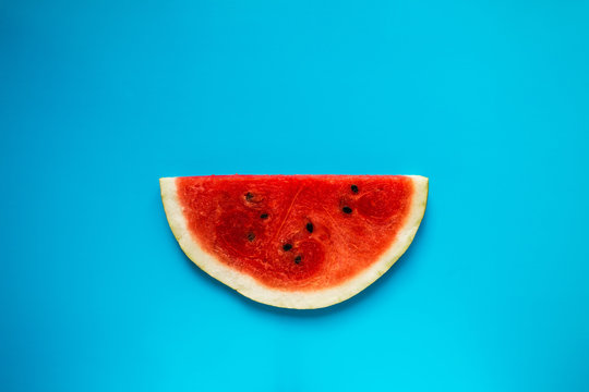 juicy slice of watermelon on a blue background