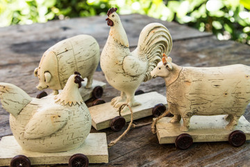 Vintage country farm primitive animals figurines - toys on wheels