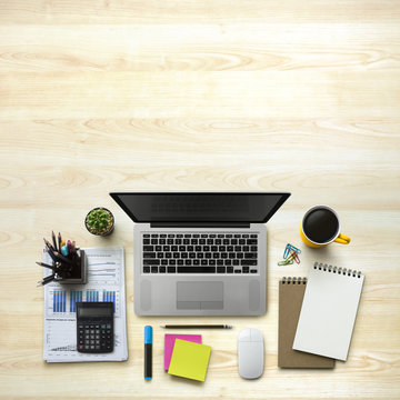 Office workplace with laptop, notebook, office supplies and stationery on wood background. Solution, business planning, data analysis, creative, design, start, or working flat lay top view concept.