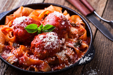 Homemade  traditional Italian pasta pappardelle with meatballs