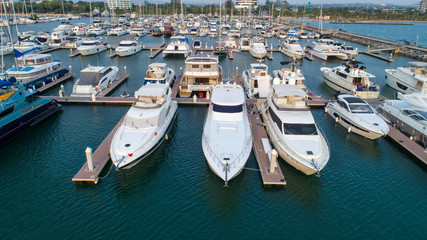 Obraz premium Pier speedboat. A marina lot. This is usually the most popular tourist attractions on the beach.Yacht and sailboat is moored at the quay.Aerial view by drone.Top view.