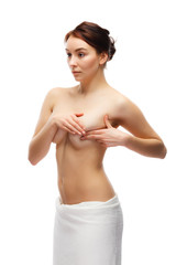 Woman examining her breast isolated on white background 