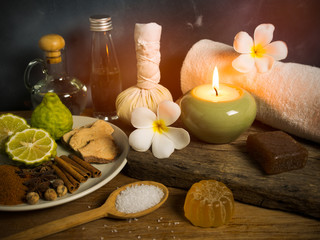 Spa massage items in candlelight.