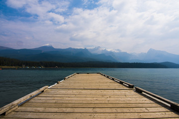 a dock at a mountain lake in canada