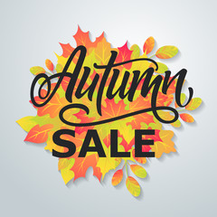 Obraz premium Autumn sale flyer on a background of leaves. Handmade vector lettering.