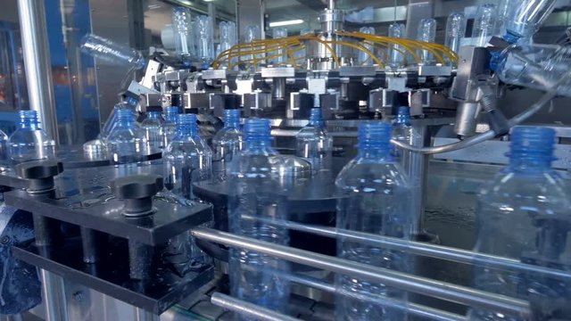 A washing and rinsing machine assembly for new PET bottles. 4K.