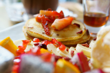 close up of pancake with fruits