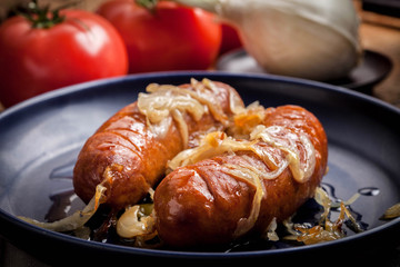 Fried sausage with onions.