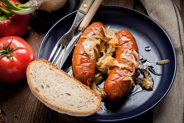 Fried sausage with onions.