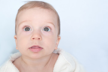 Little boy looking up amazed
