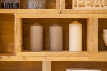 Fototapeta na wymiar White candle in wooden box