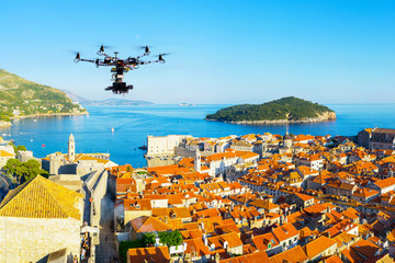 Professional heavy drone with a cinema camera flying above the old city at summer day. Croatia, Dubrovnik.