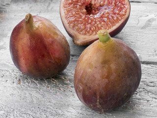 Close-up of figs on dark stone  background