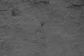 Wall fragment with scratches and cracks