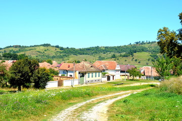 Typical rural landscape and peasant houses in the village Merghindeal- Mergenthal,...