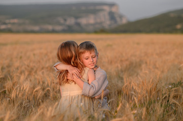 Beautiful children play outdoor. Children in vintage village.