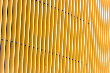 Detail of yellow metal building facade