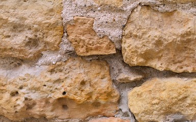Limestone wall with cement as a background