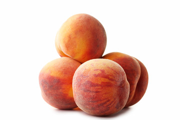Ripe peaches fruit isolated on a white background