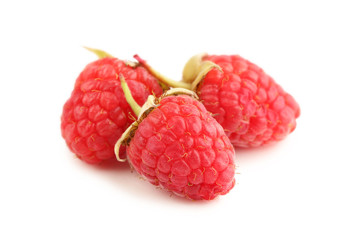 Sweet and ripe raspberries isolated on white