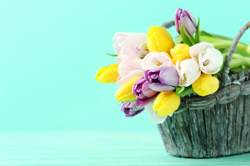 Fototapeta na wymiar Bouquet of tulips on green wooden table