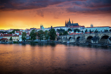 Fantastic natural phenomena summer storm over Charles bridge, Prague castle and Vltava river in Prague, Czech Republic