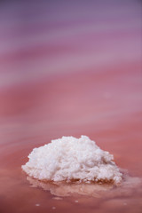 Macro View of the salt rock in red water Salinas Torrevieja Spain Sunny day with reflective surface