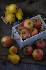 Juicy fruits in old white vintage wooden box. Red apples and yellow pears. Low key moon light 03